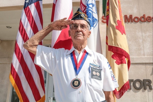 Victor Labarca Lago renders a salute. Labarca Lago is one of the members of the Borinqueneers who frequently visits Fort Buchanan.