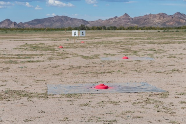 Yuma Test Center provided a wide area laid out with six lanes of high explosive mines with inert fuzes comprised of both US M-15 and foreign TM-62M. The team placed the mines strategically atop a tarp to track how the mortar shrapnel hit each mine and the surrounding area. (Photo by Sean Mazza)